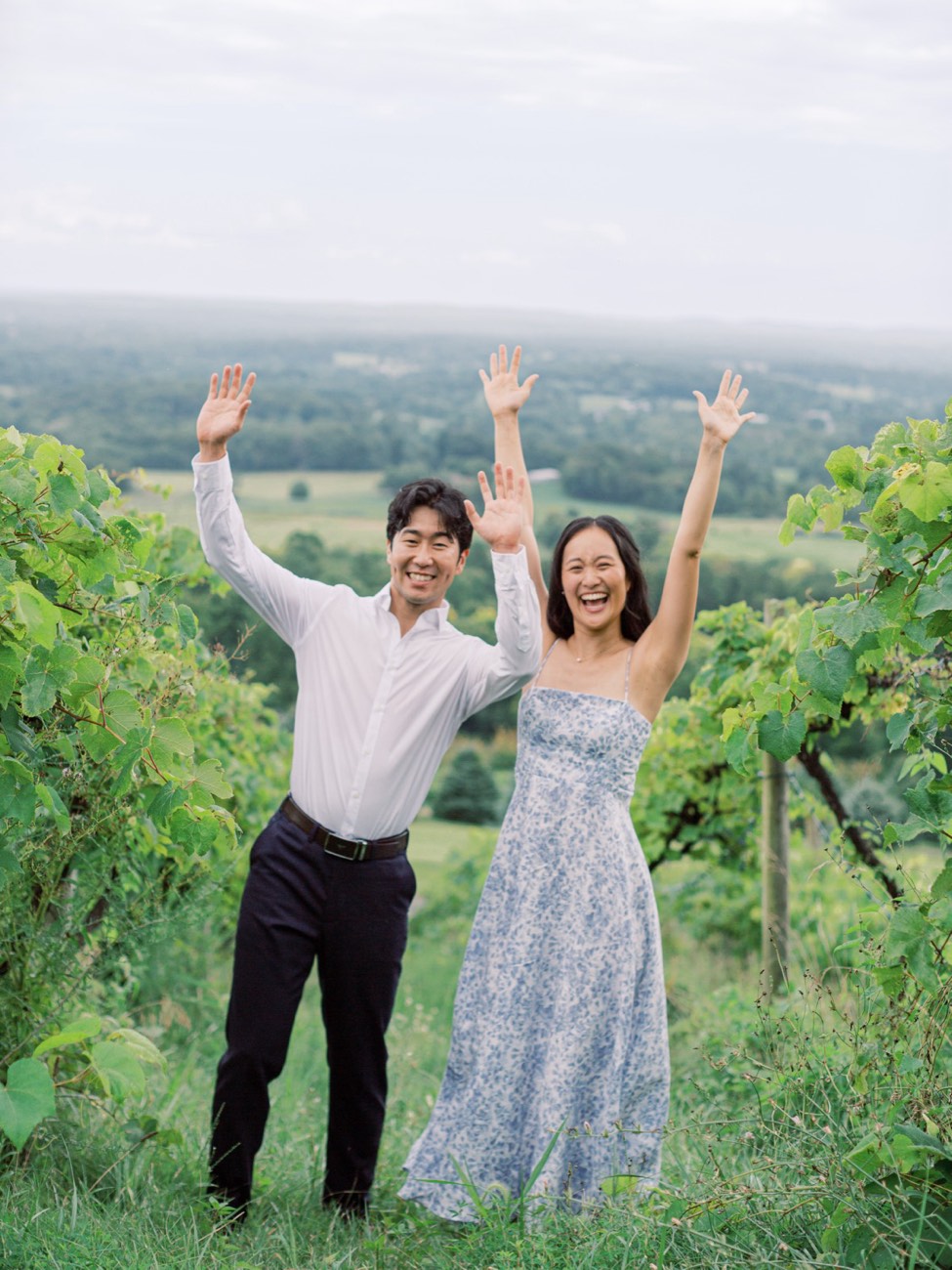 Christina and Erik cheering in the vineyard